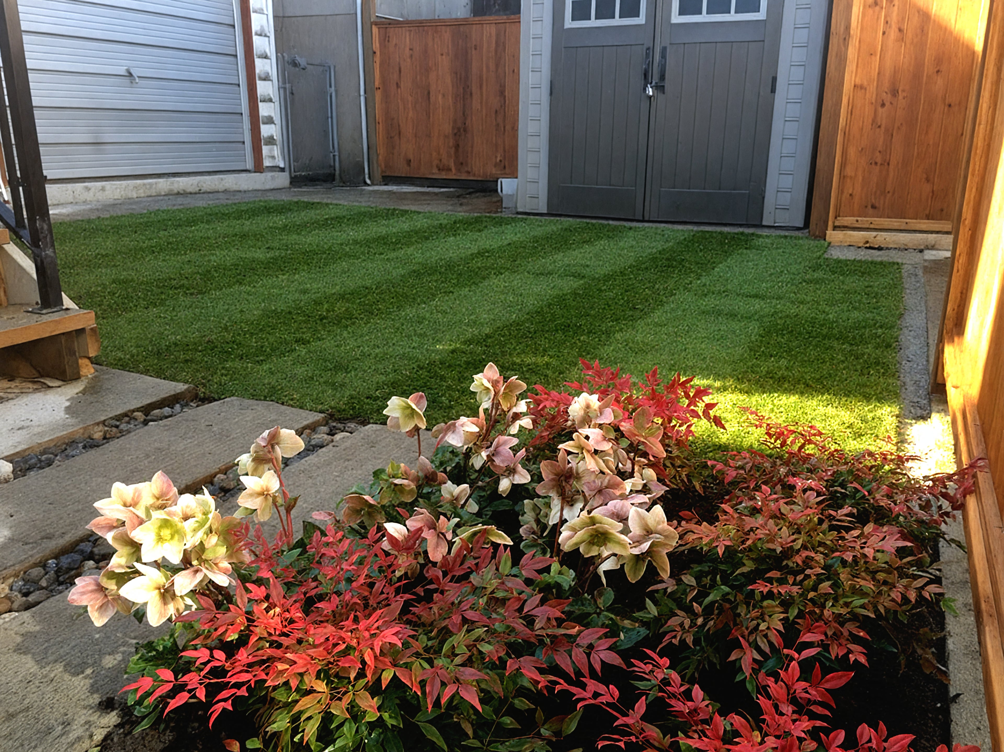 Garden beds, Sod lawn, Concrete slabs and River rock at the East 22nd project.