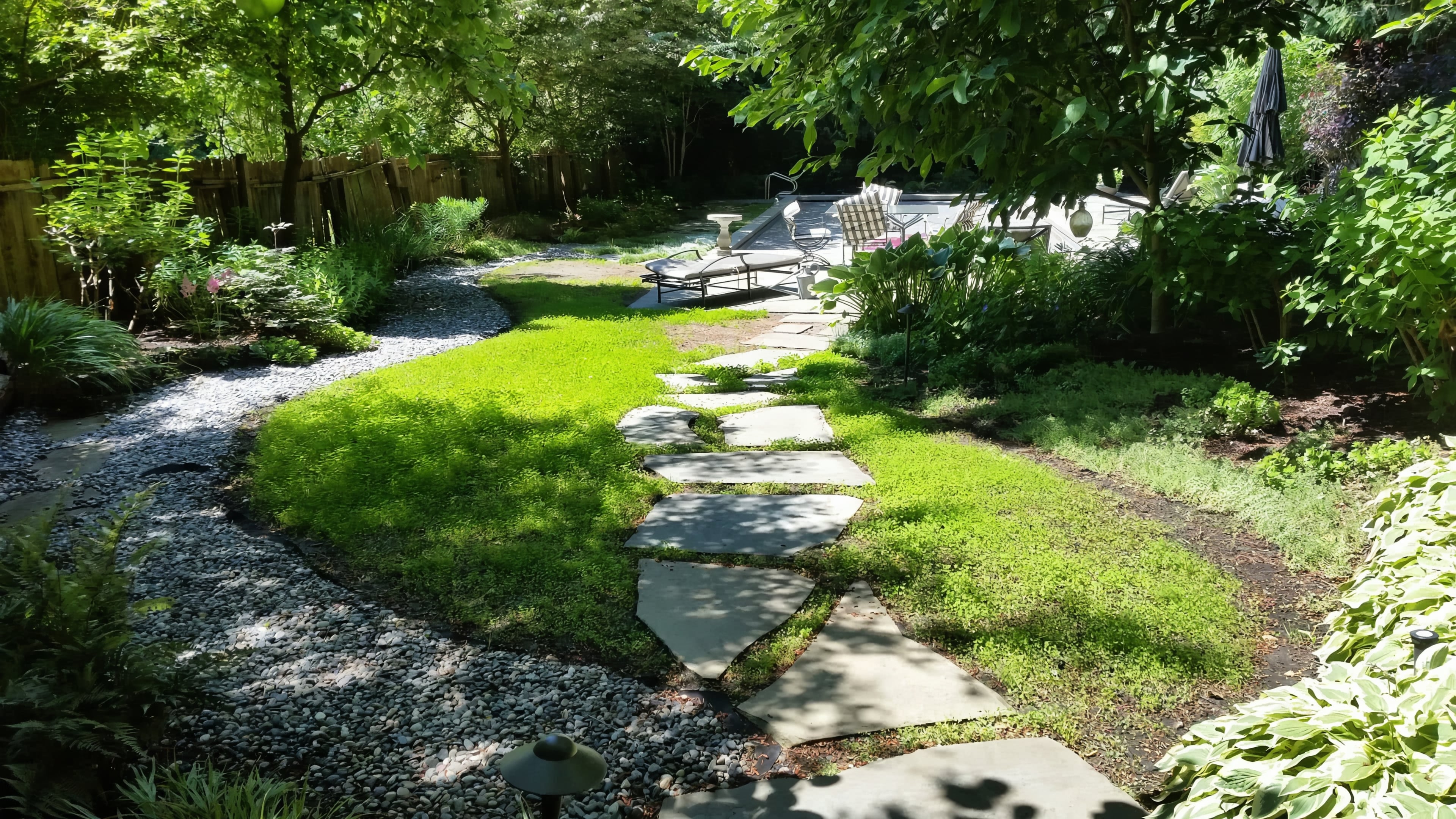 Micro clover, Seasonal planting, Sod lawn and River rock at the Elm St project.