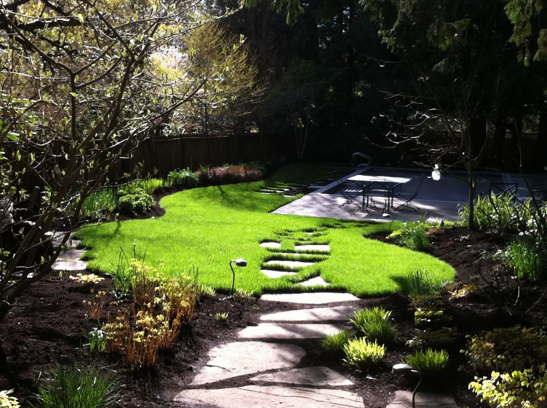 Micro clover, Seasonal planting, Sod lawn and River rock at the Elm St project.