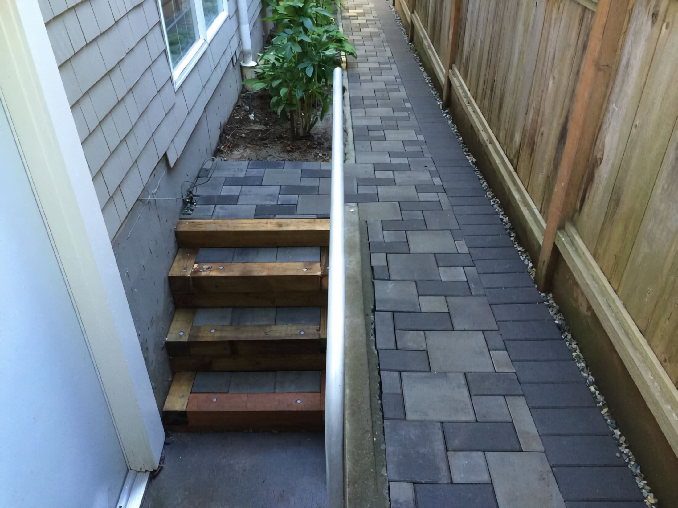 Interlocking pavers, Micro clover, Garden beds and Plants at the West 11th project.