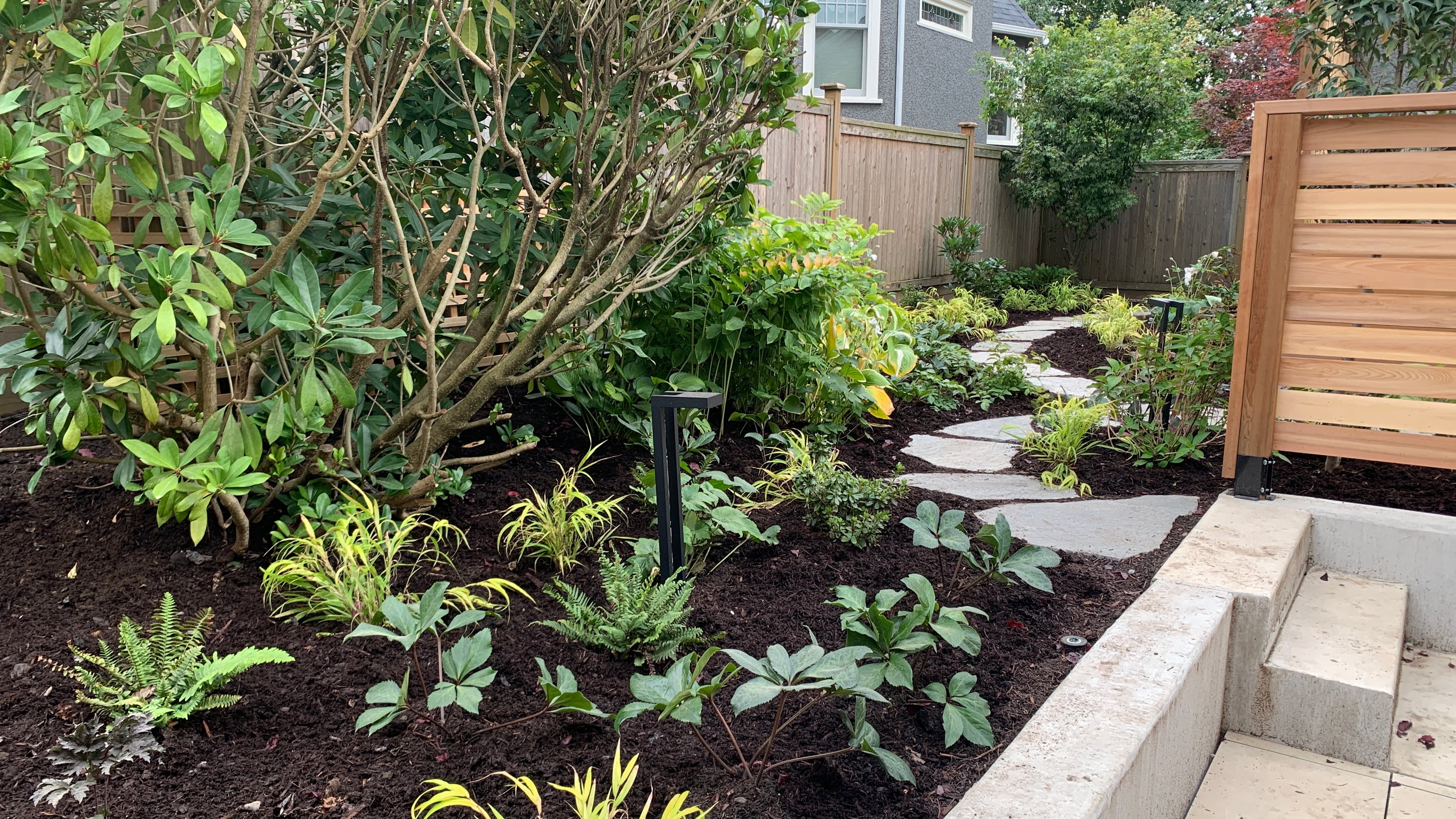 Natural stone pavers, Garden boxes, Hedges and Outdoor Lighting at the West 15th project.