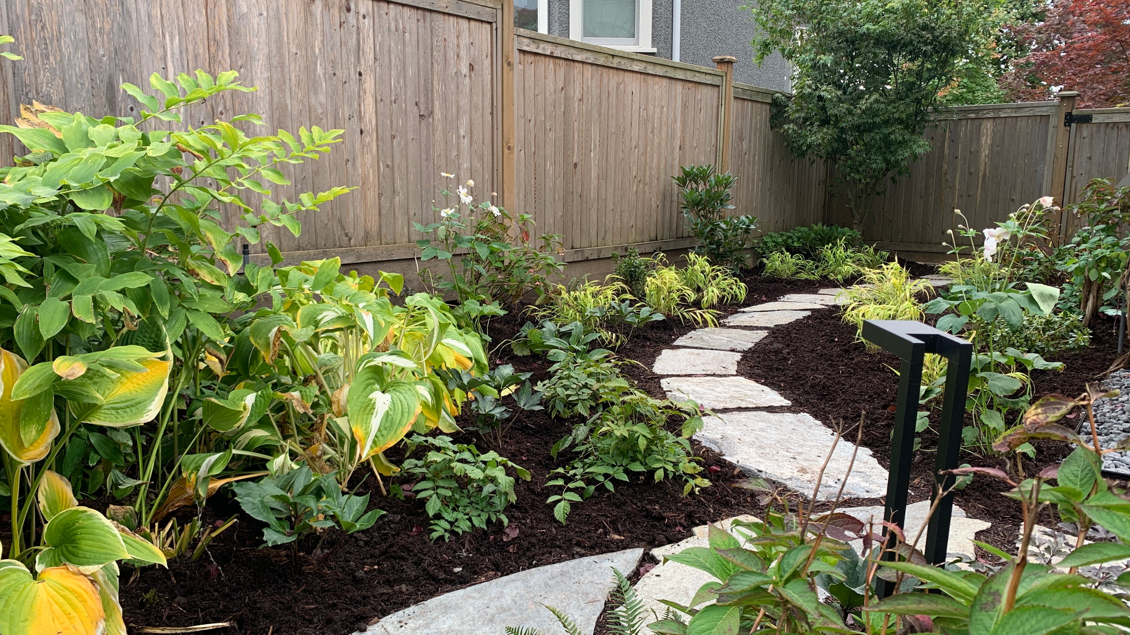 Natural stone pavers, Garden boxes, Hedges and Outdoor Lighting at the West 15th project.