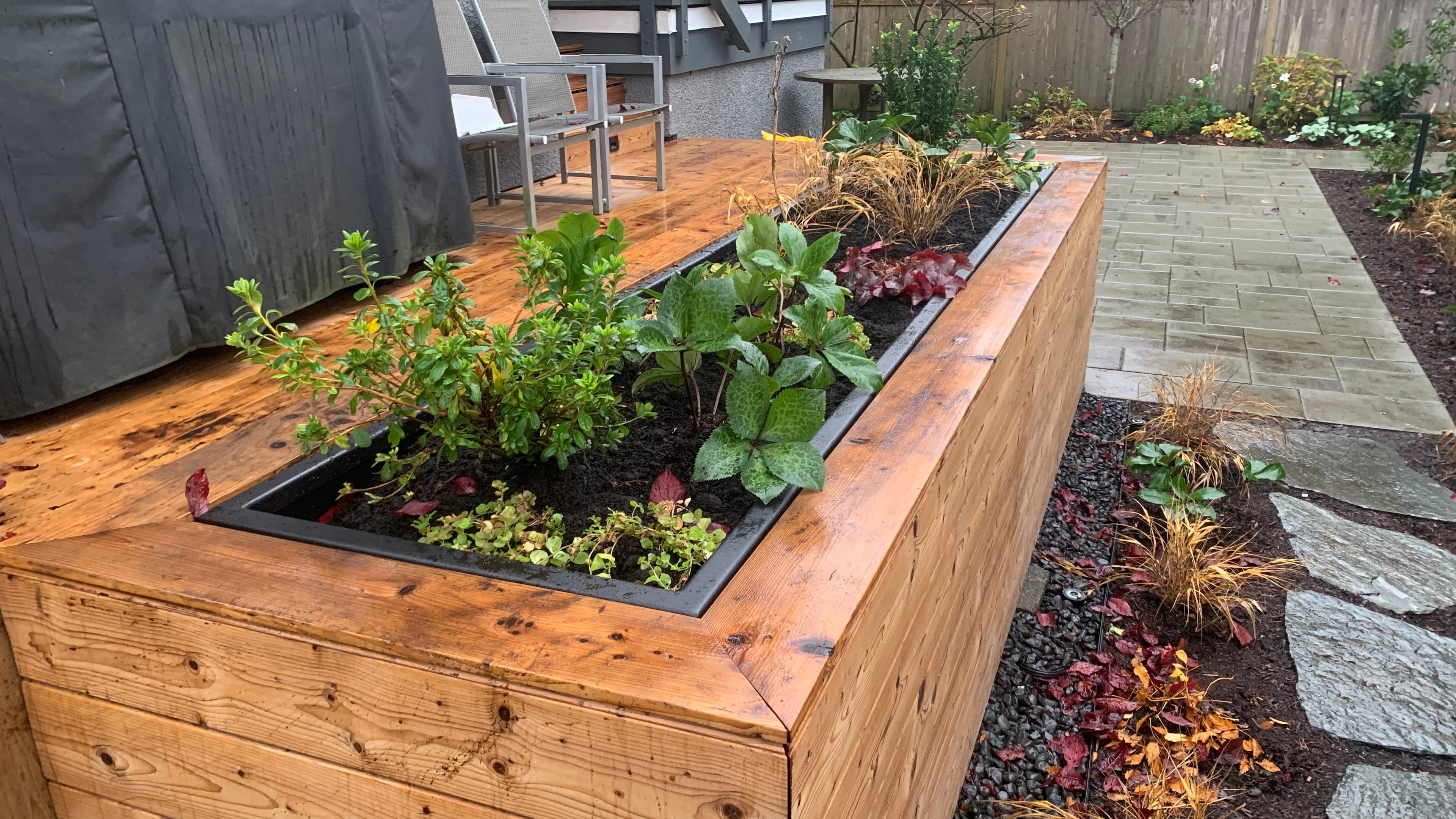 Natural stone pavers, Garden boxes, Hedges and Outdoor Lighting at the West 15th project.
