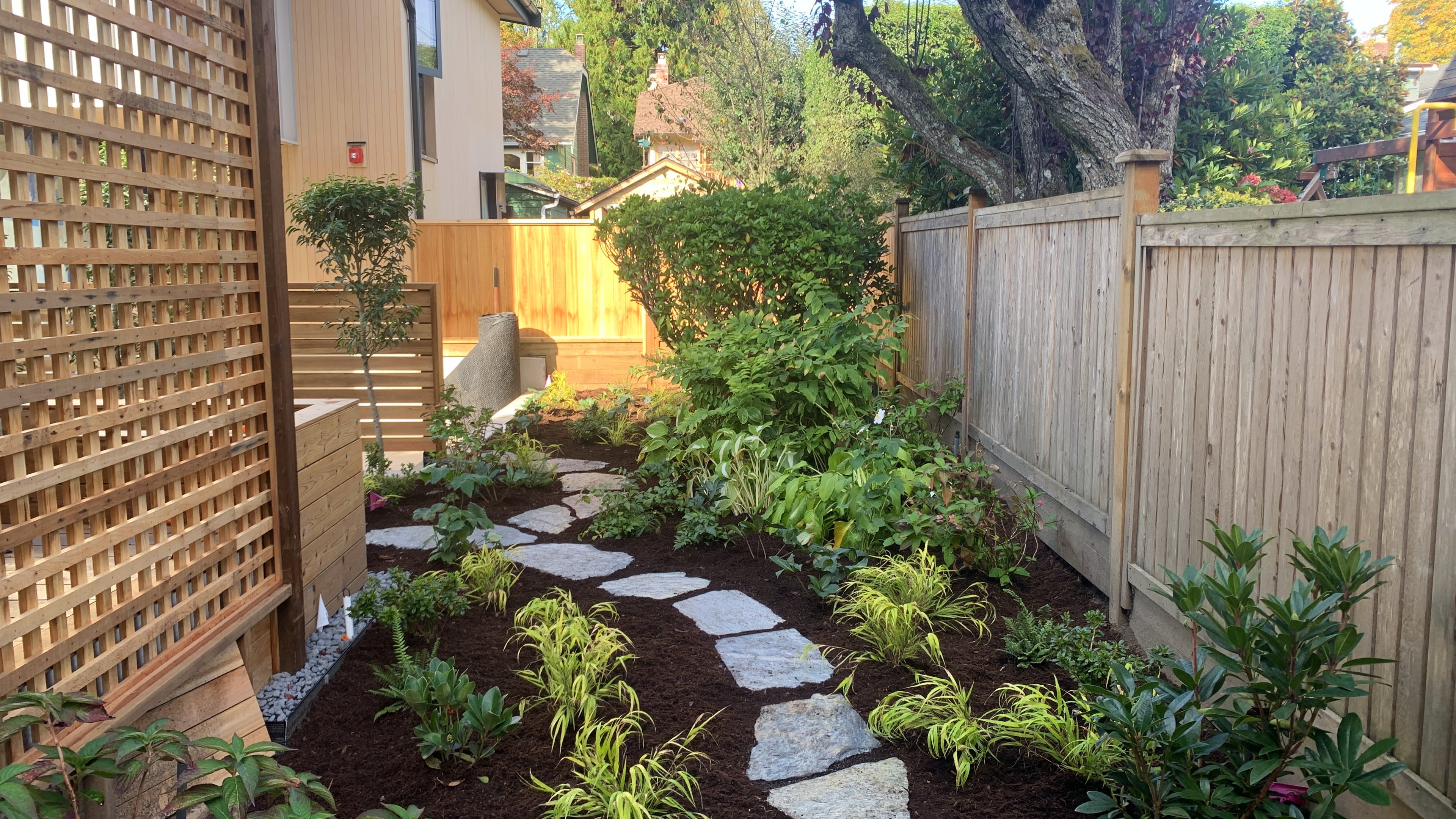 Natural stone pavers, Garden boxes, Hedges and Outdoor Lighting at the West 15th project.