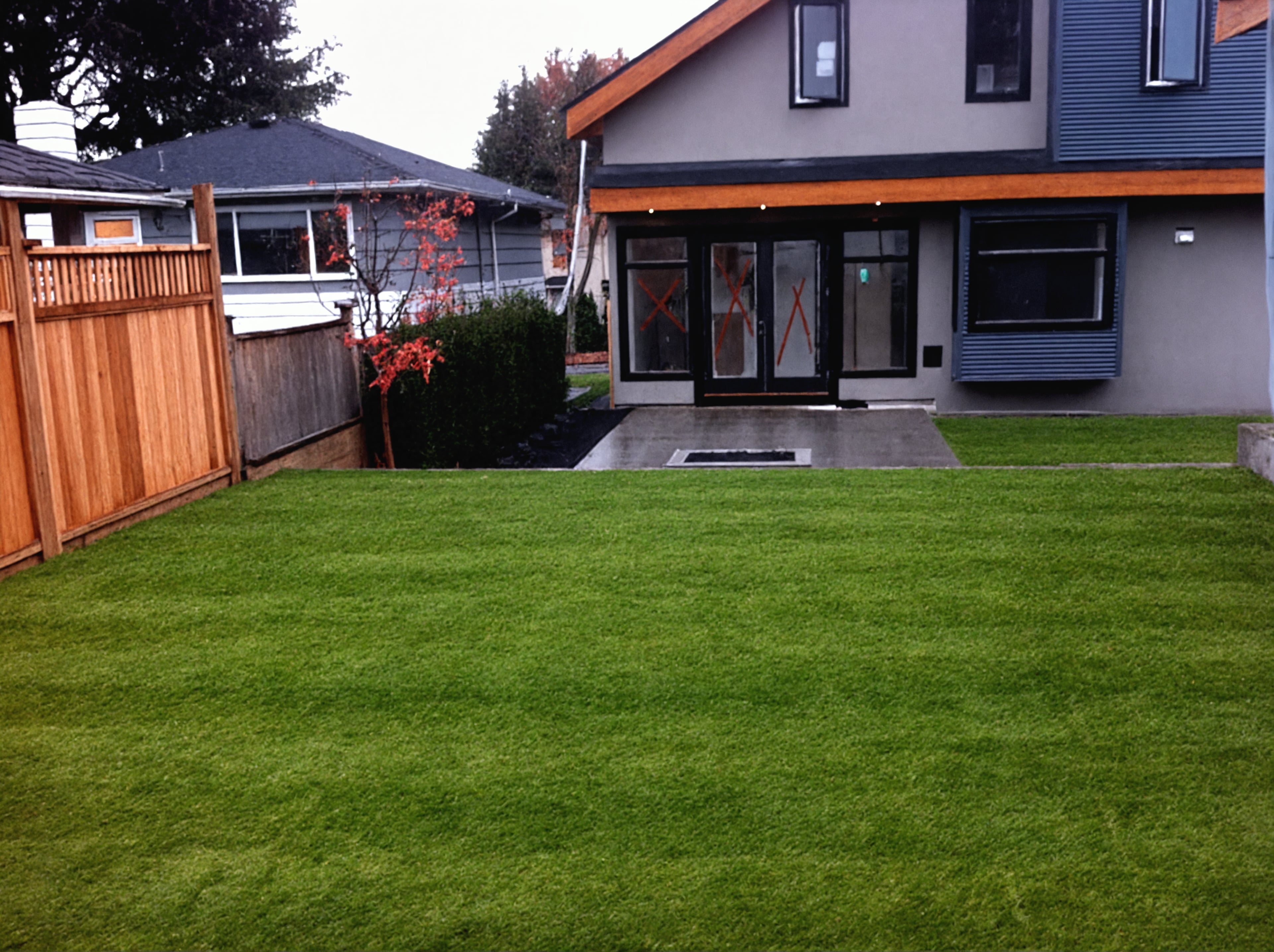 Sod lawn, Concrete slabs, Hedges and Plants at the West 32nd project.