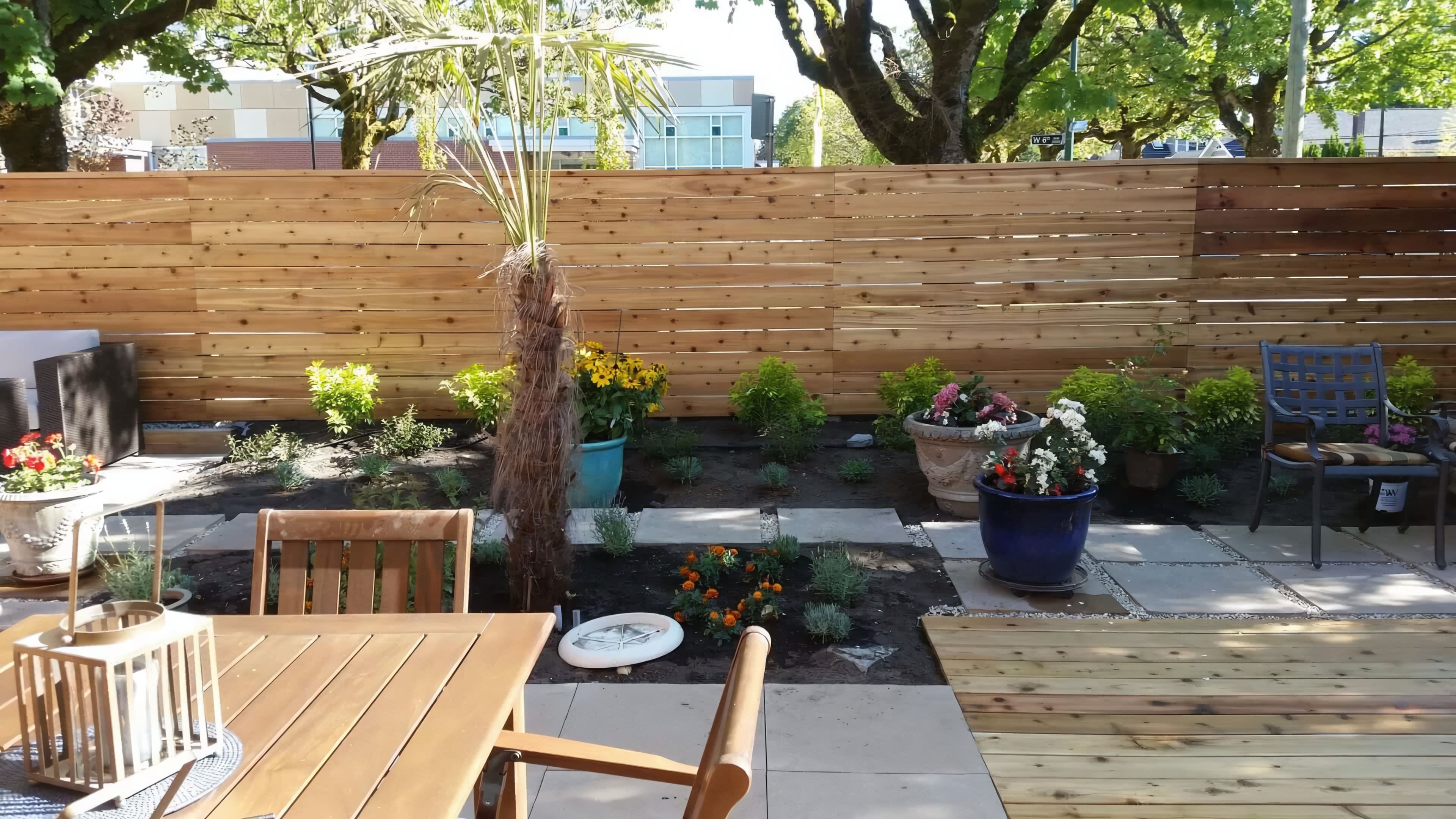 Cedar fencing, Cedar patio, Concrete slabs and Trees at the West 6th project.