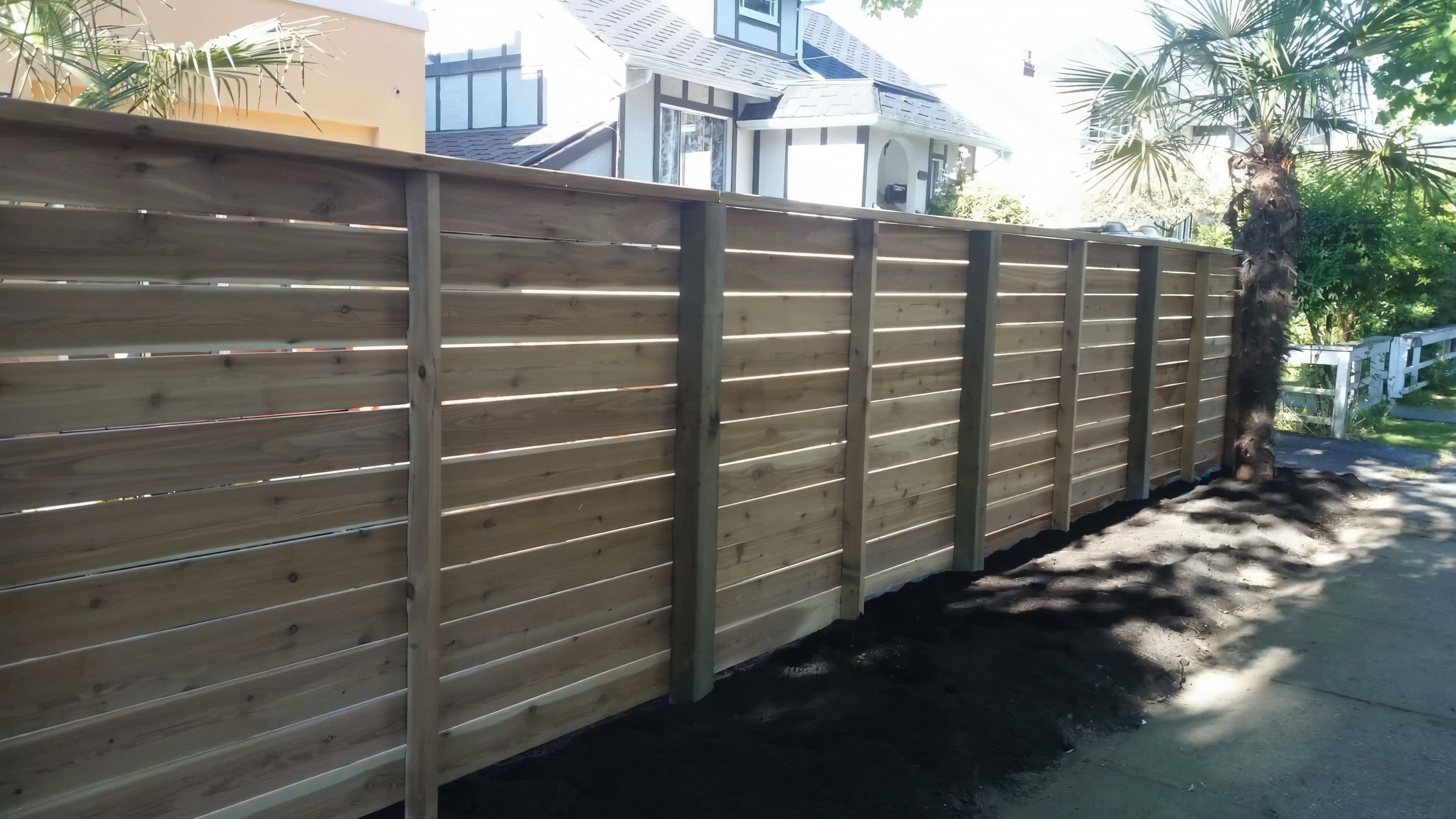 Cedar fencing, Cedar patio, Concrete slabs and Trees at the West 6th project.